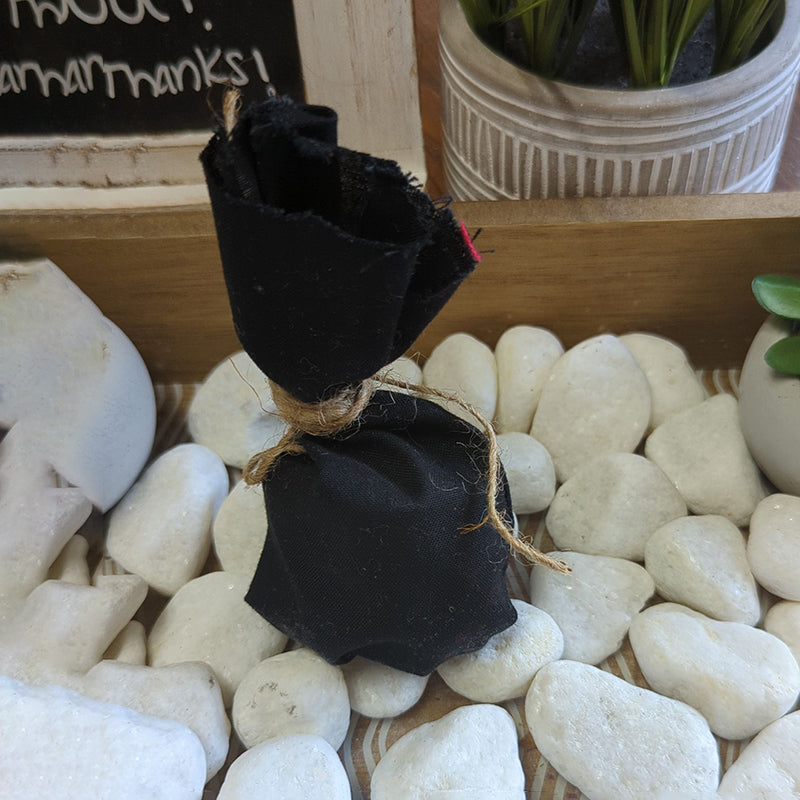 Protection Mojo Bag on white stones, offering personal guardian charm for negativity protection.