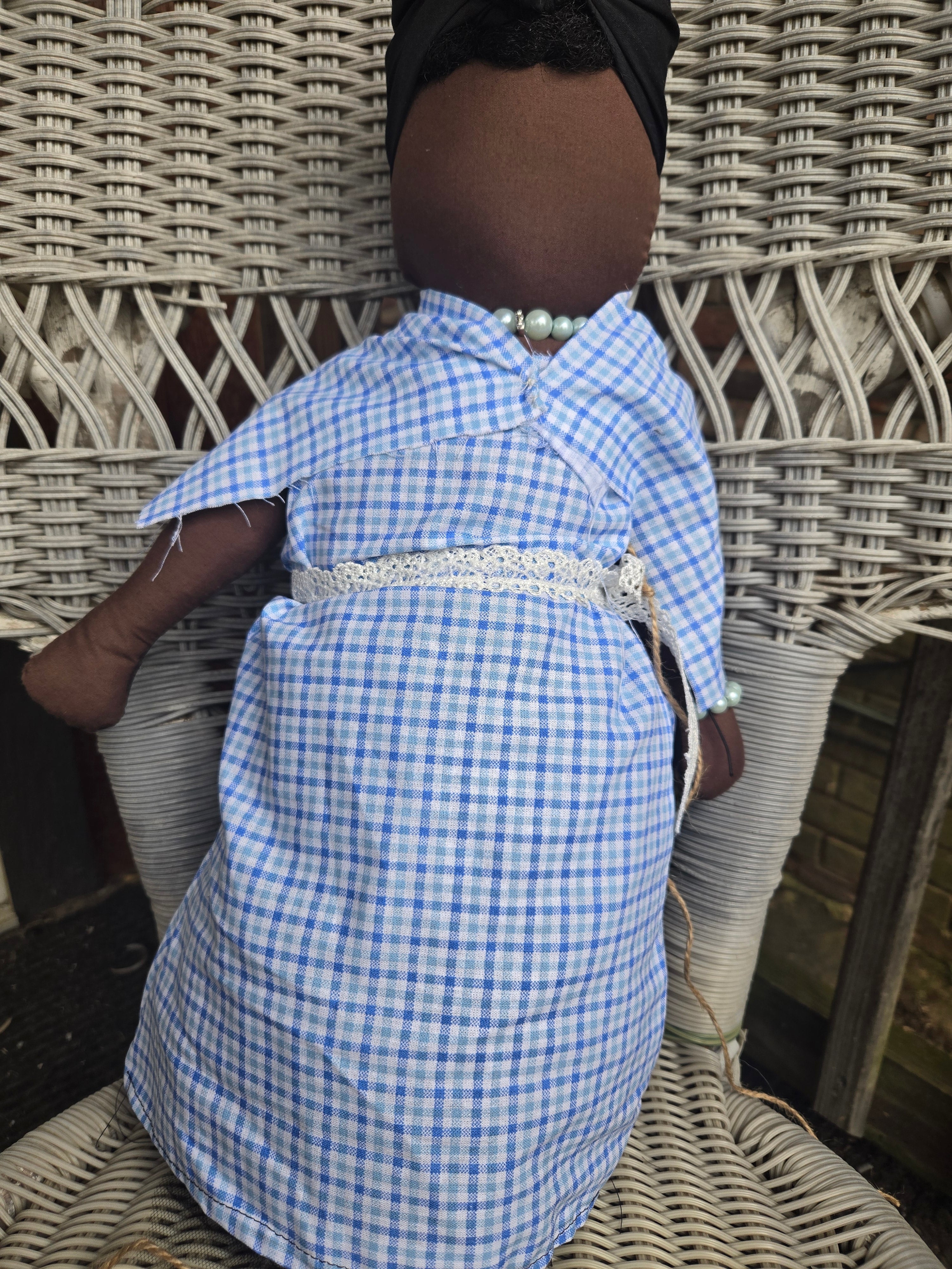 Big Mama ancestor doll representing someone who needs support, focusing on their well-being.