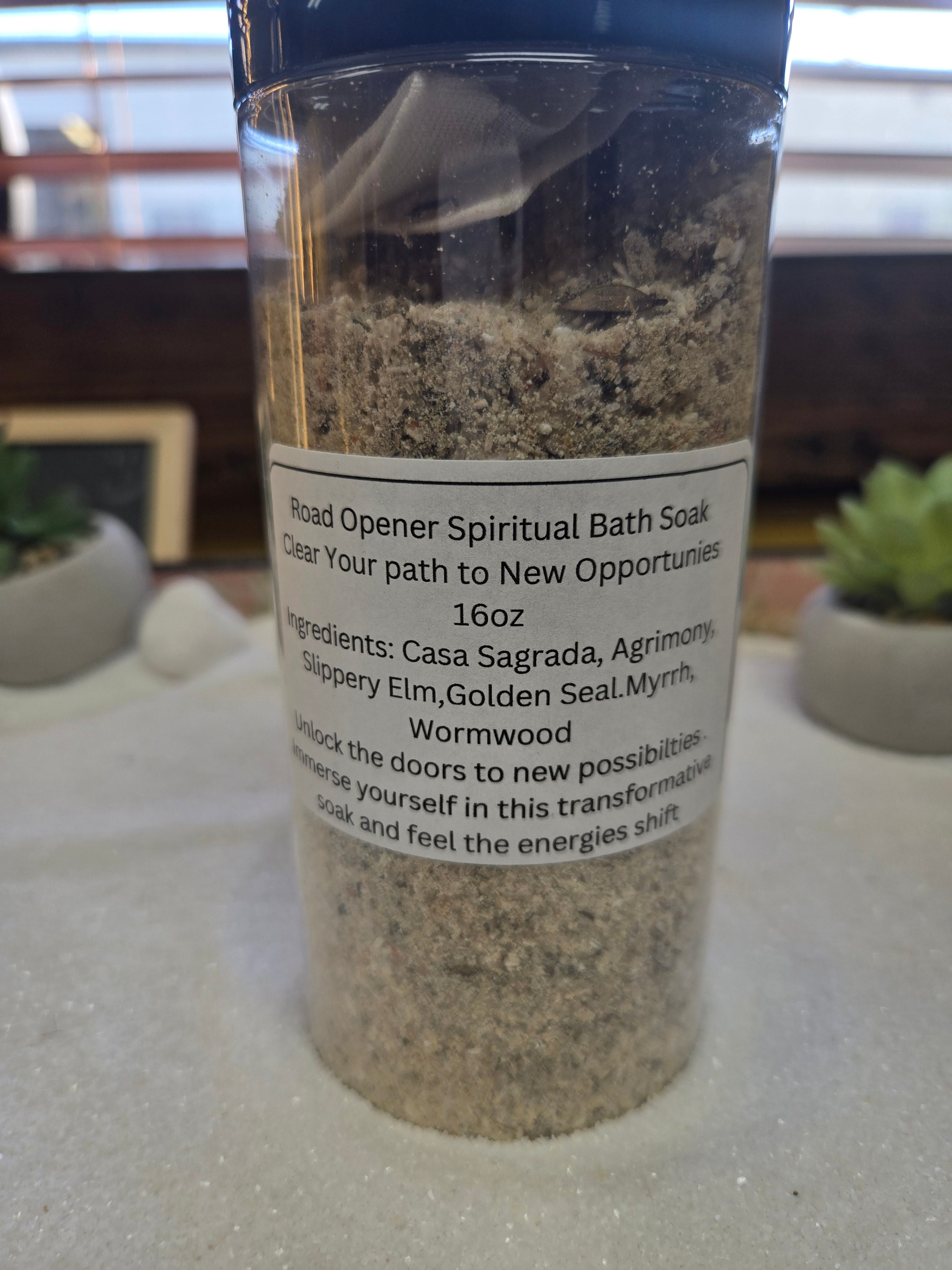 Spiritual Road Opener bath salt in clear container with natural ingredients for new beginnings and pathway clearing