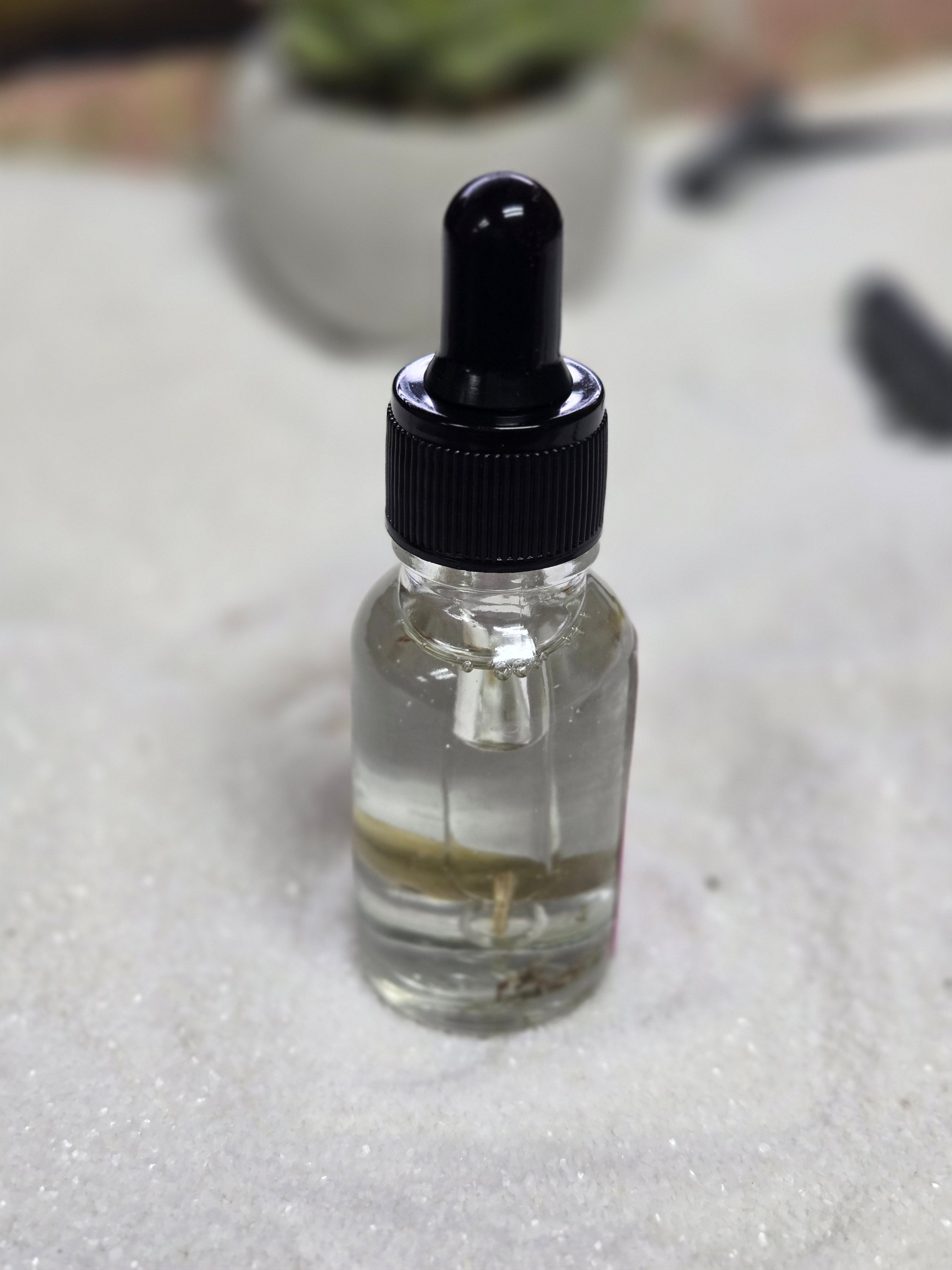 1901 Angel Oil bottle with dropper for divine love attraction and spiritual connection