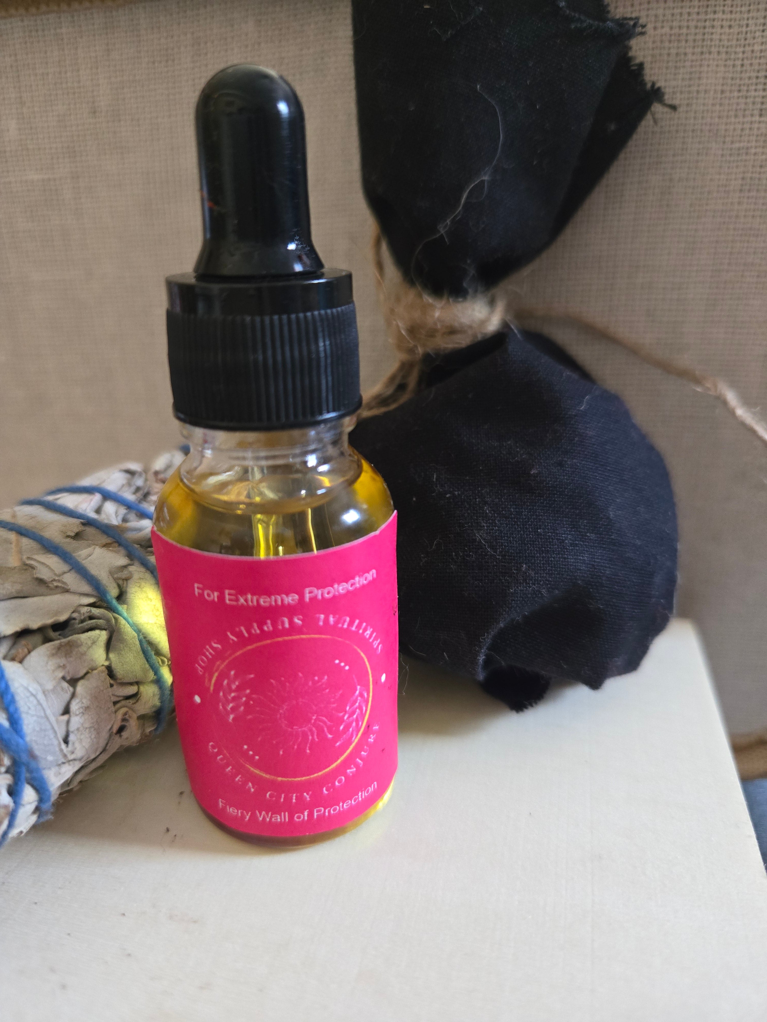 Protection Bundle includes Dragon Blood Protection Oil, Fiery Wall of Protection Oil, sage stick, Protection Mojo Bag and Railroad Spike Queen City Conjure