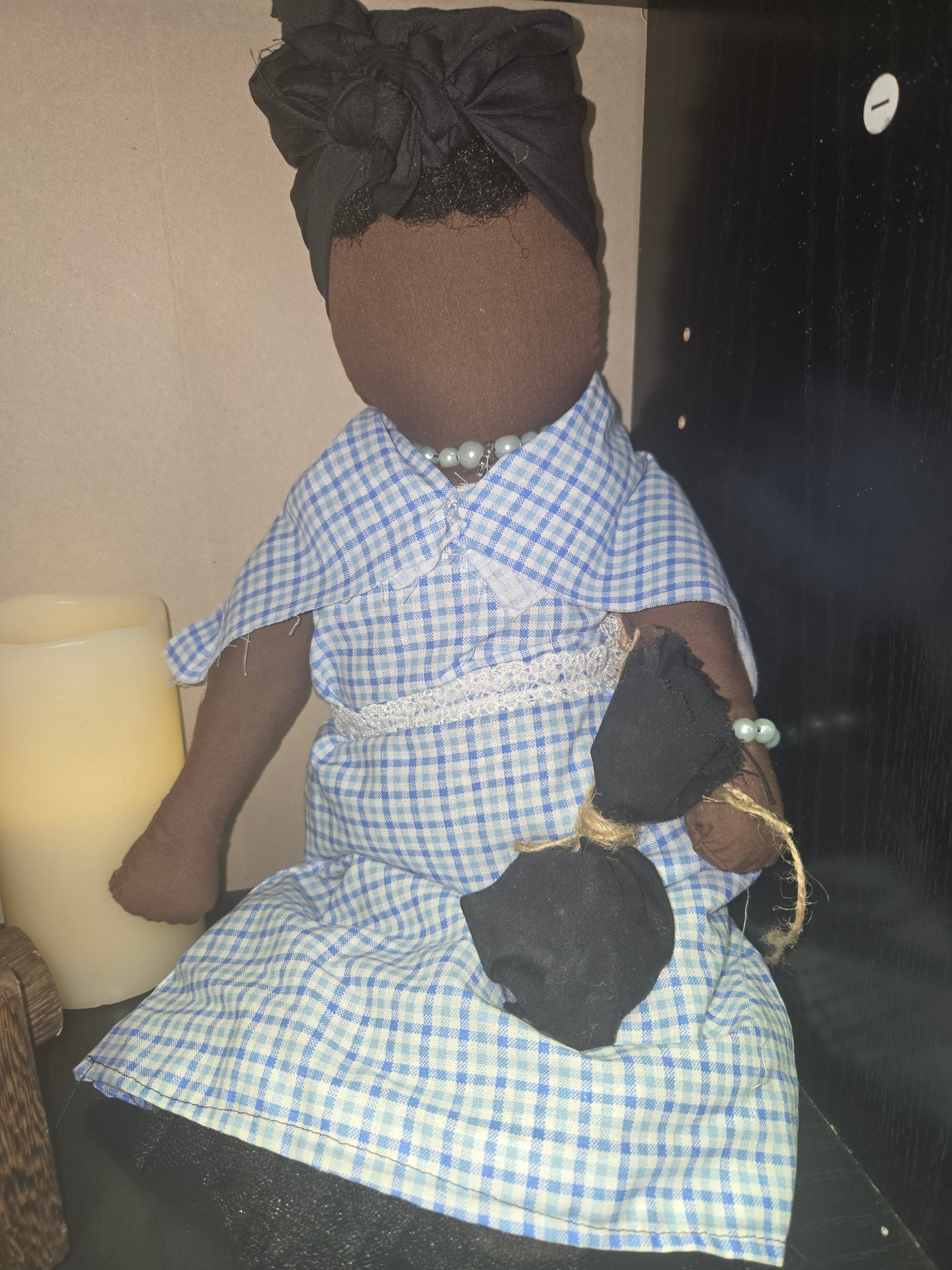 Big Mama ancestor doll representing someone who needs support, focusing on their well-being.