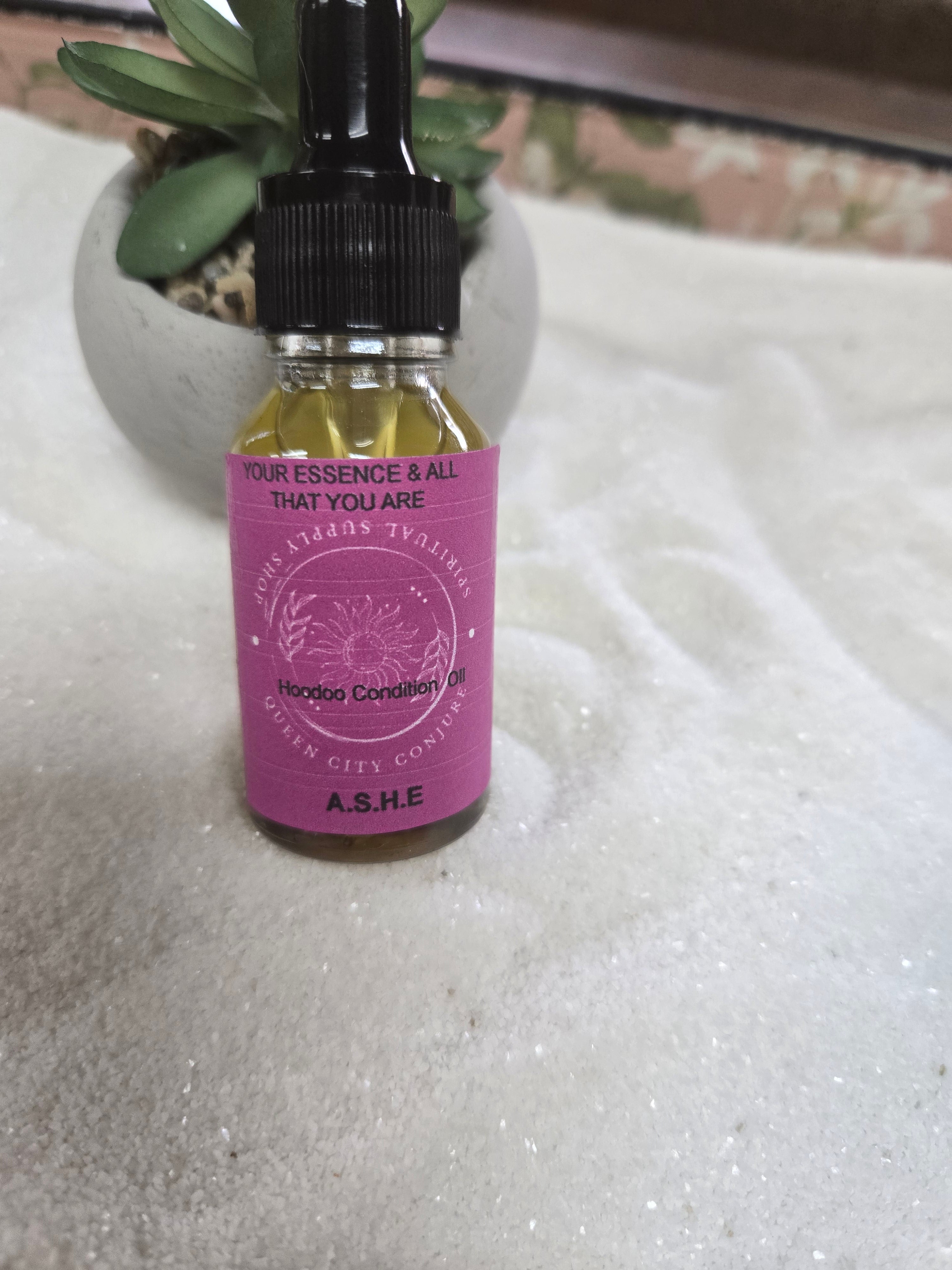 Ashè  Spiritual Oil bottle  enhancing personal enlightenment and empowerment.