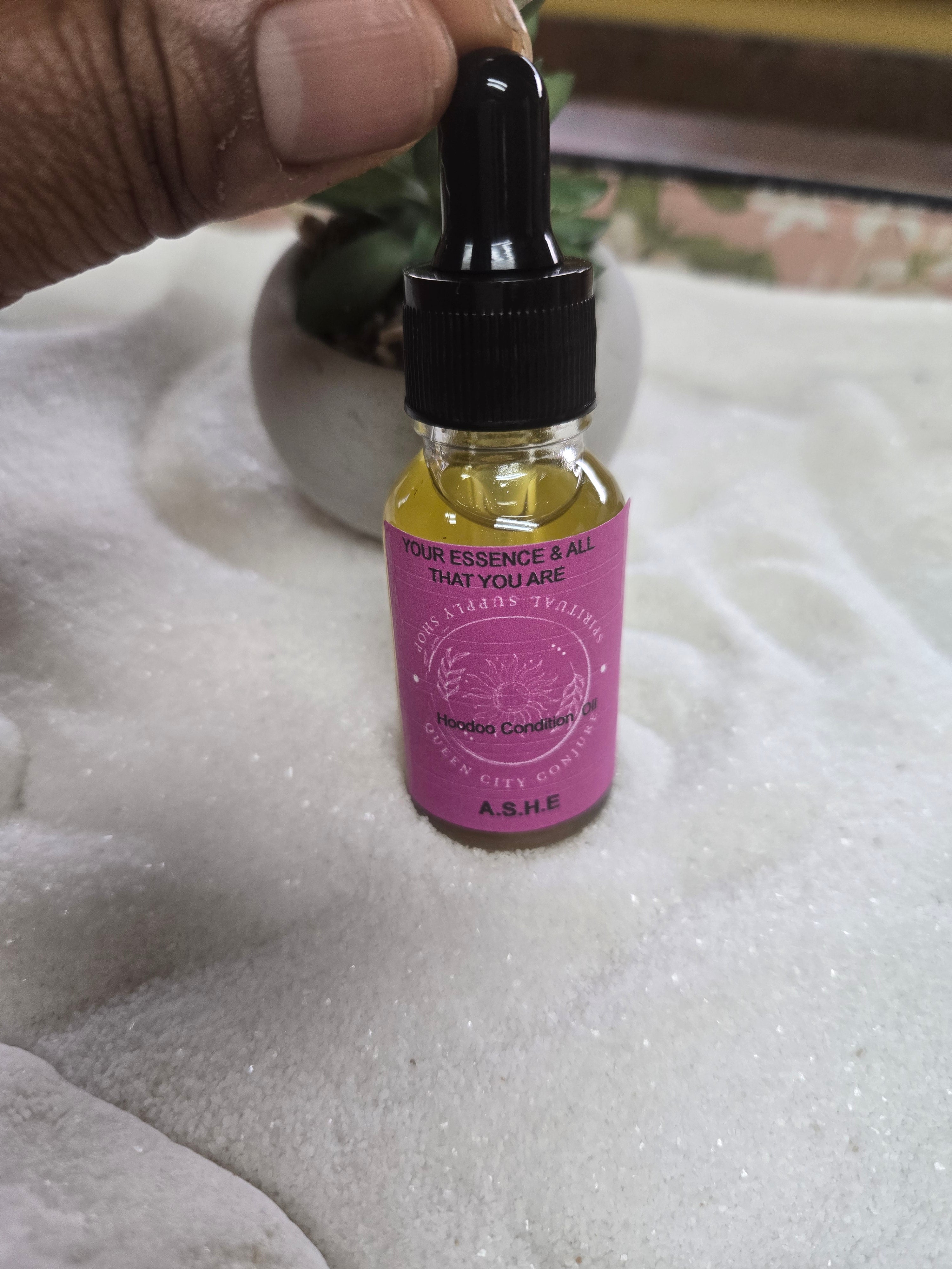 Ashè  Spiritual Oil bottle  enhancing personal enlightenment and empowerment.