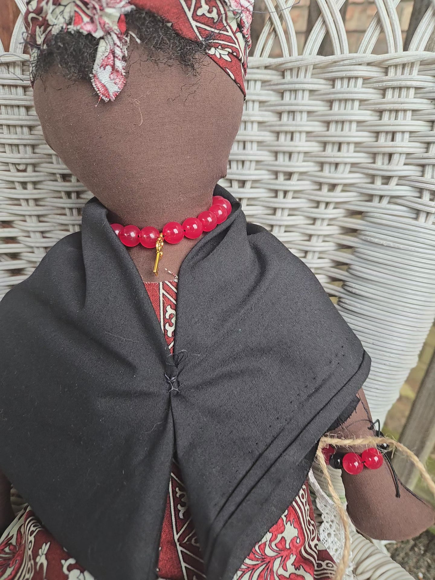 Big Mama ancestor doll  representing someone who needs support, focusing on their well-being.