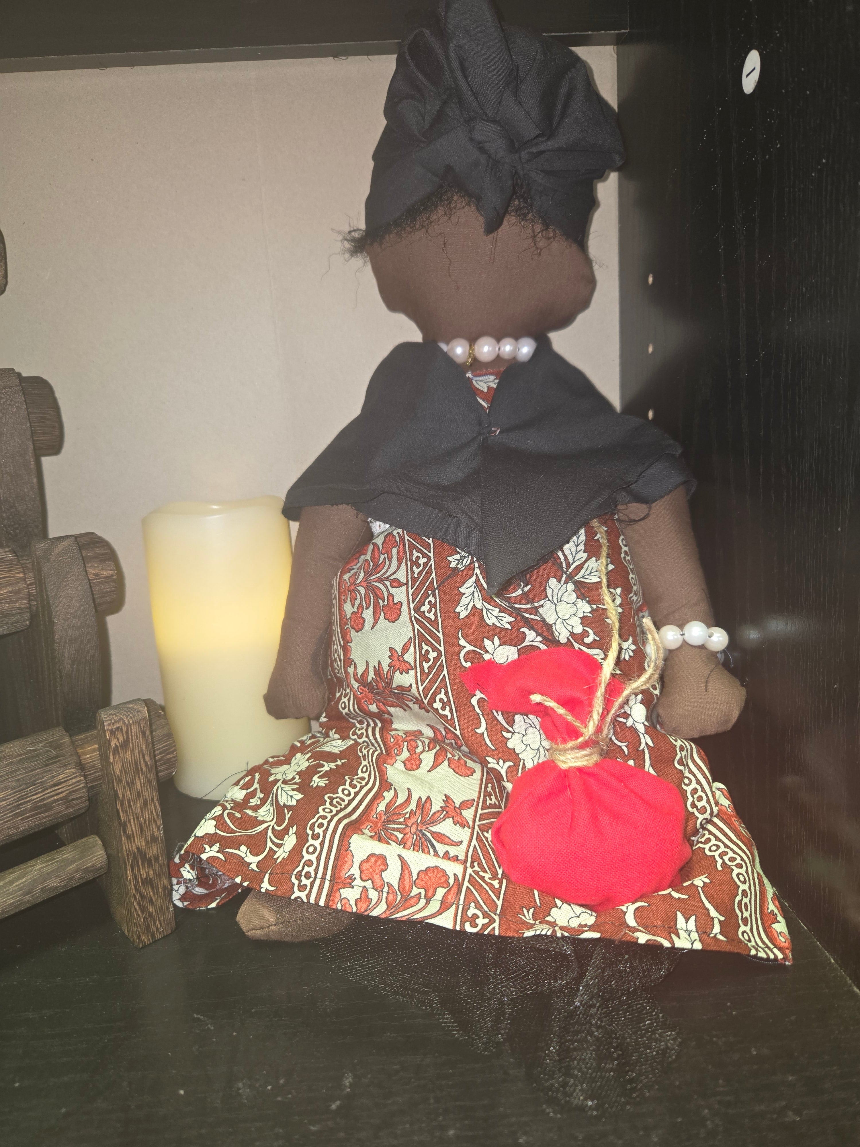 Big Mama ancestor doll  representing someone who needs support, focusing on their well-being.