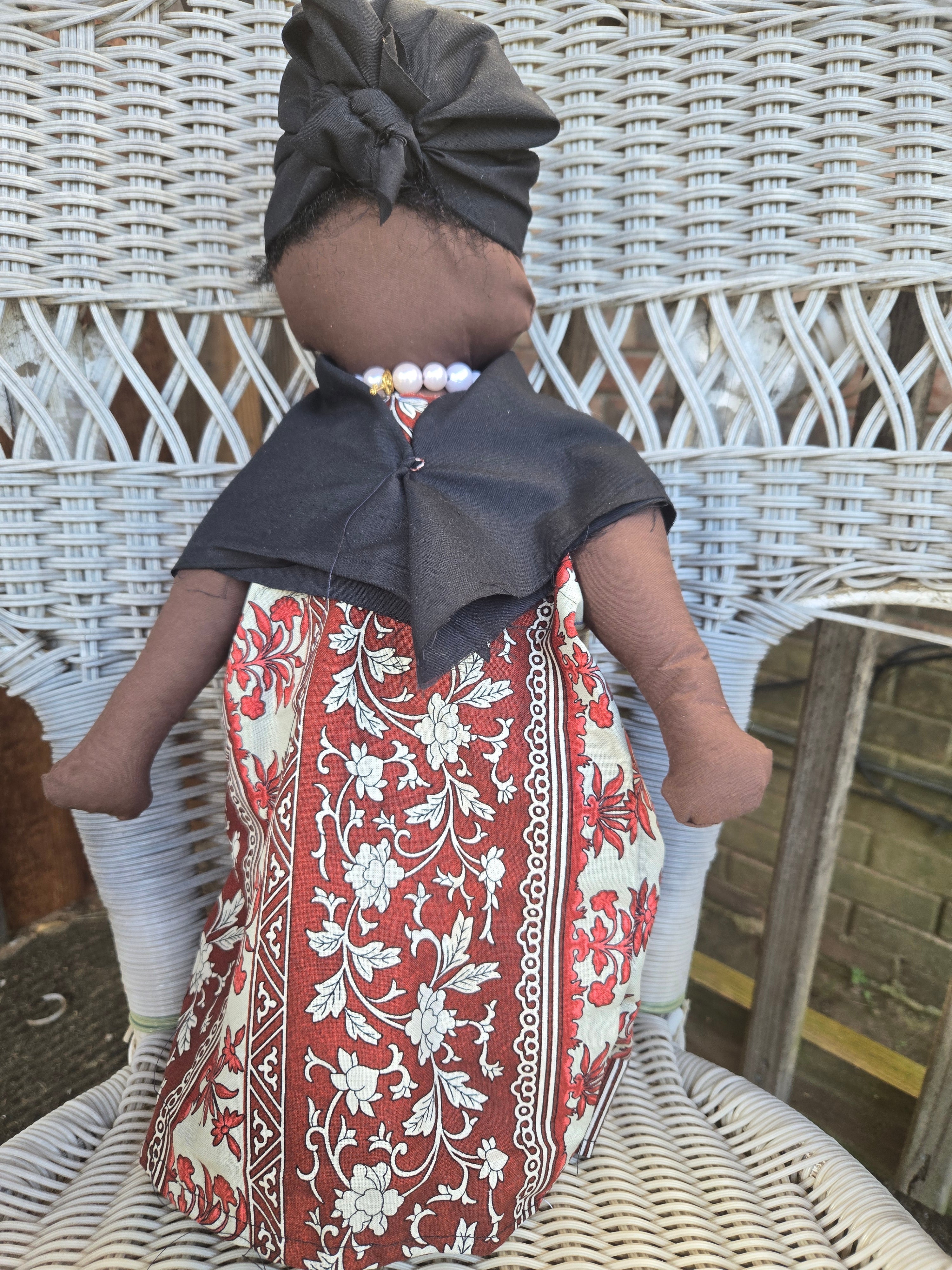 Big Mama ancestor doll  representing someone who needs support, focusing on their well-being.
