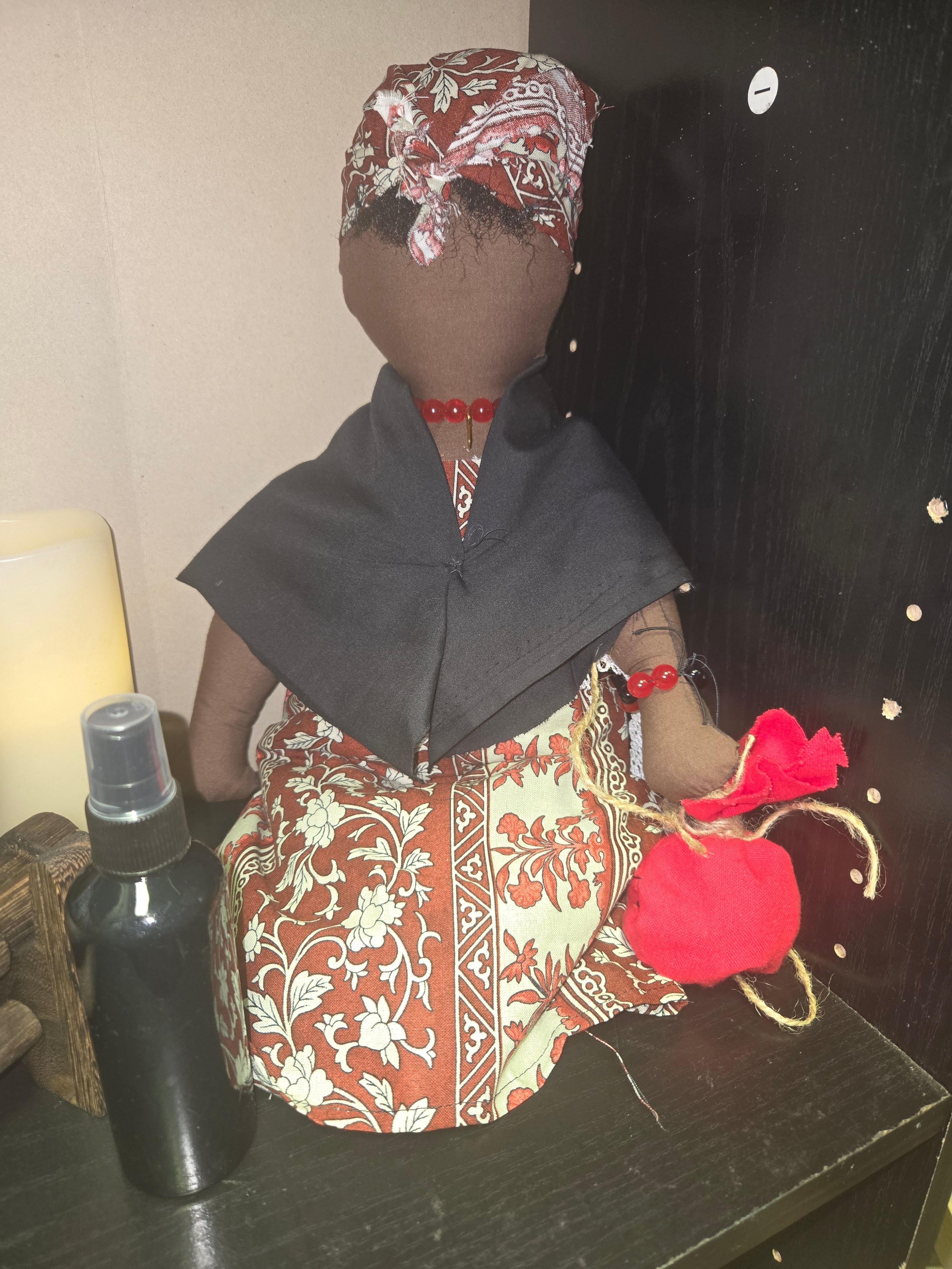 Big Mama ancestor doll  representing someone who needs support, focusing on their well-being.