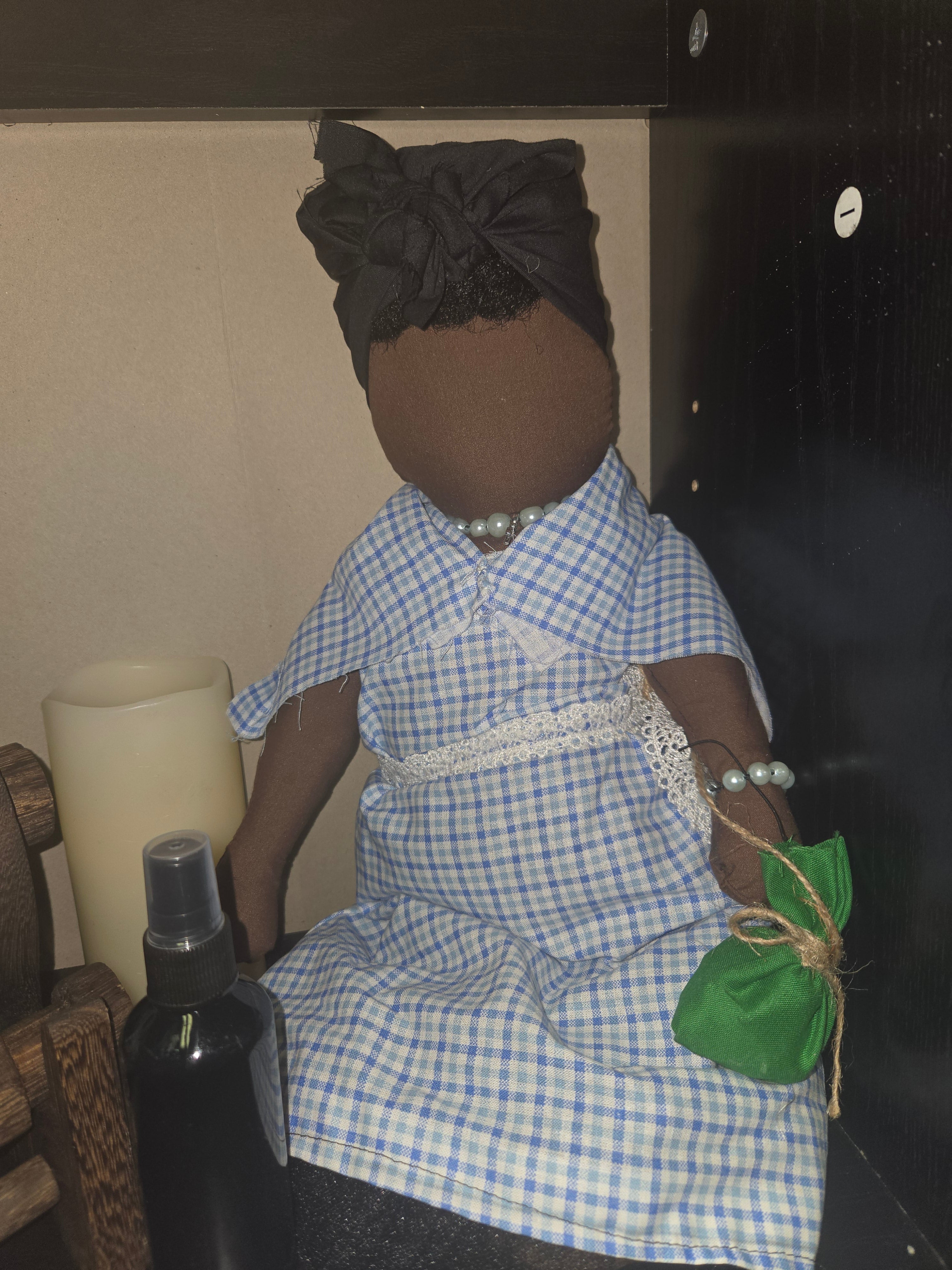 Big Mama ancestor doll  representing someone who needs support, focusing on their well-being.