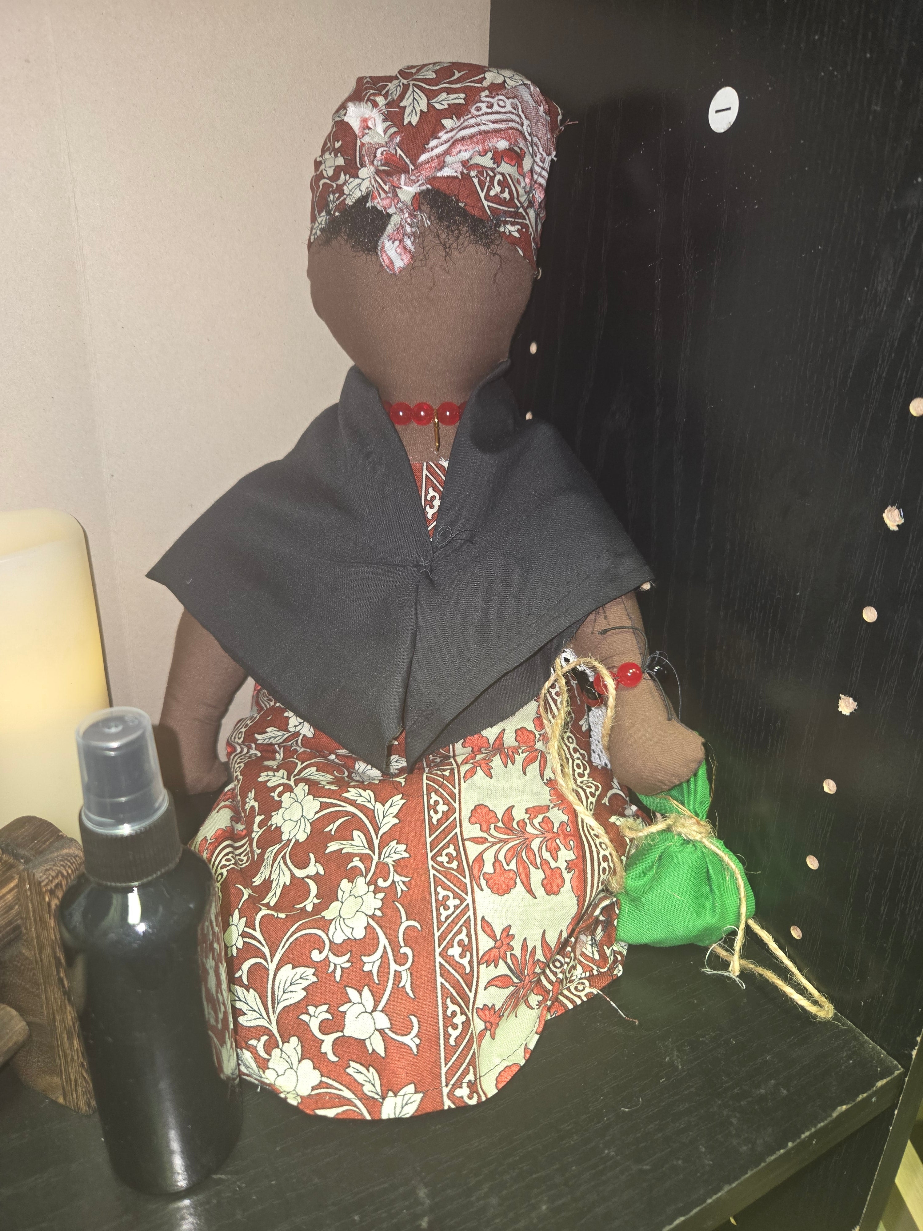 Big Mama ancestor doll  representing someone who needs support, focusing on their well-being.